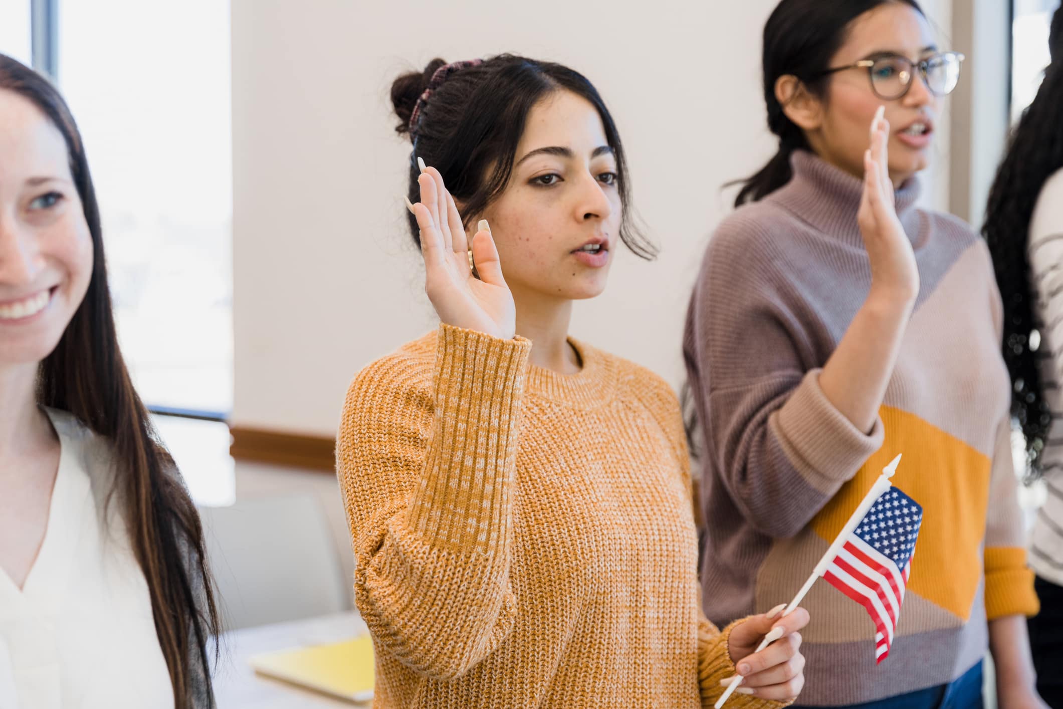Girl with right-hand raised